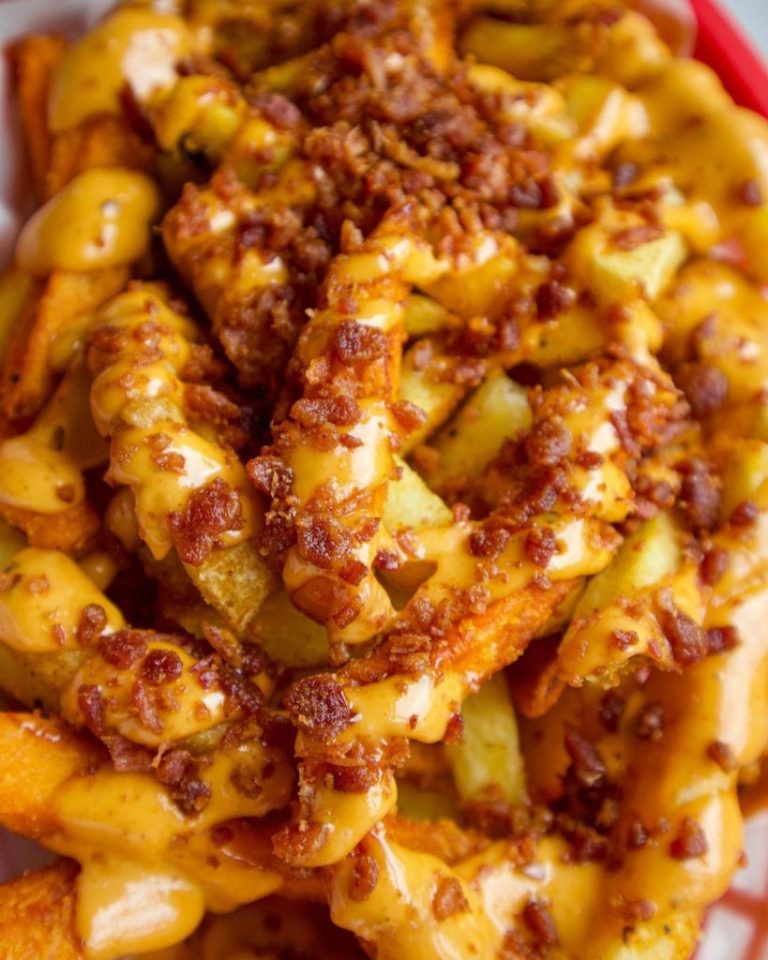 Almost Famous Close up Bacon Bacon Fries with gooey cheese